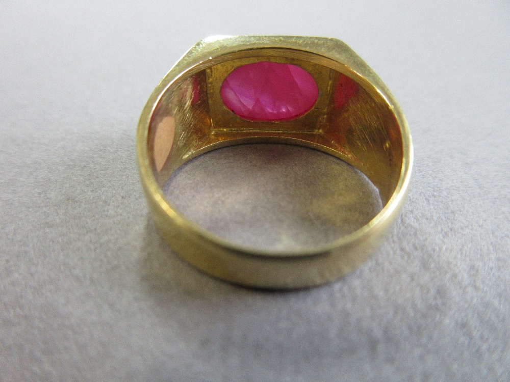 A star ruby single stone ring, the oval cabochon ruby set horizontally in a collet on a flat - Image 4 of 6