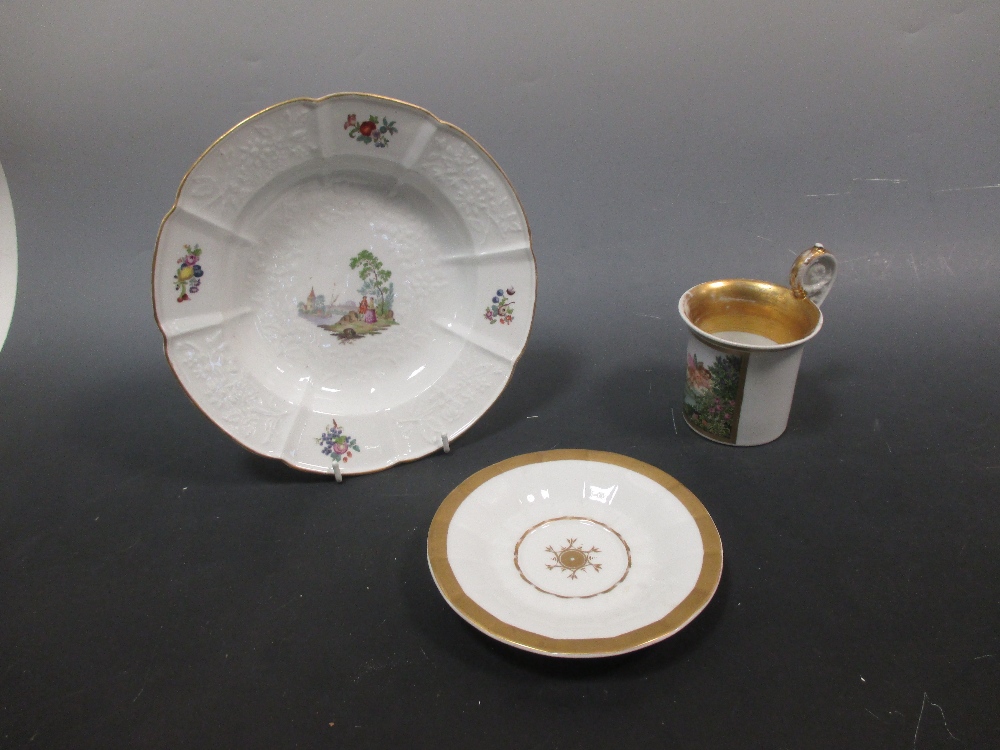 A Berlin cabinet cup and saucer (restored) and a Meissen plate