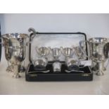 A quantity of silver trophy cups and a silver cruet, cased (gross approx. 19oz, not including