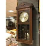 A 1930s oak case wall clock 78cm