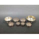 Six various silver circular boxes and covers and two silver bowls
