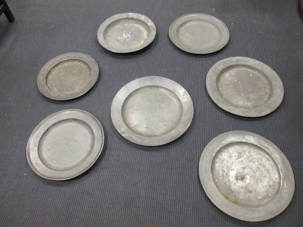 Seven 18th/19th century pewter chargers