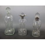 Two silver mounted liqueur decanters and another plain decanter (3)