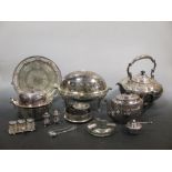 A quantity of silver plated ware to include a large circular teapot, a turnover breakfast dish, a