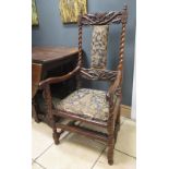 A 17th century walnut high back elbow chair