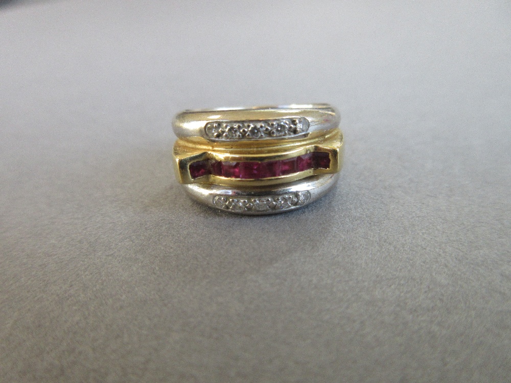 A modern ruby and diamond band ring, the central band of yellow precious metal channel set to the - Image 5 of 5