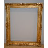 A 19th Century gilt and swept frame, 79 x 63 cm sight size