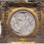 A round imitation marble reliefi plaque in gilt frame
