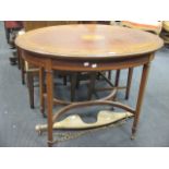 An oval Edwardian table, 75cm high