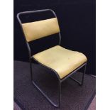 A set of ten industrial tubular steel stacking chairs by Shepherd Products, each with yellow vinyl