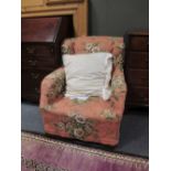 Two pink upholstered armchairs