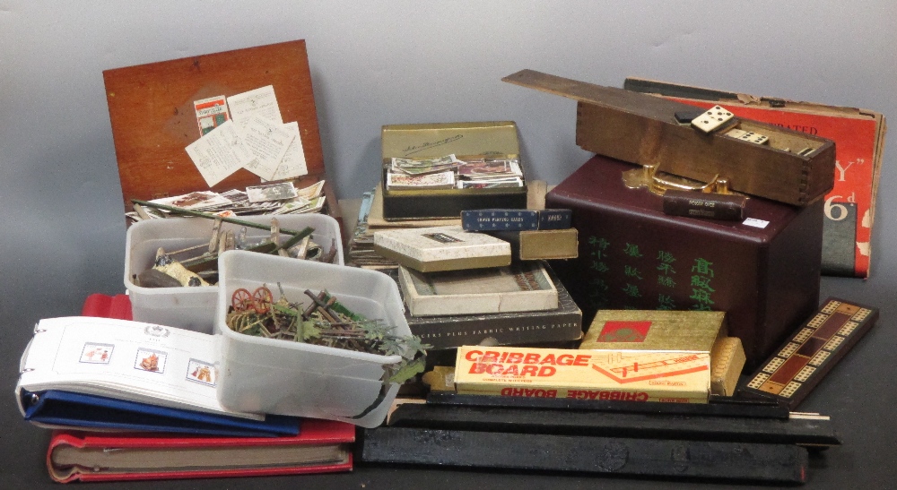 A quantity of cigarette cards, a mahjong set and other items inc. stamps and lead zoo and farm