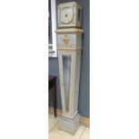 A Continental grey-green painted neoclassical style pedestal clock, silvered dial, modern electric