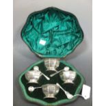 A set of four silver octagonal salts and spoons, London 1897, in shaped fitted case