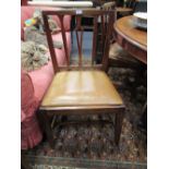 A set of four George IV ash and elm dining chairs with vase splat and rail backs (4)