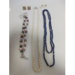 A graduated cultured pearl necklace with diamond set clasp, a lapis lazuli bead necklace, a two