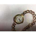 A lady's 18ct gold wristwatch, early 20th century, with white dial and Roman numerals, Swiss