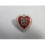 A Victorian heart shaped enamel, seed pearl and diamond brooch / pendant, the red guilloche enamel