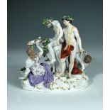 A 19th century Meissen figure group of the Drunken Silenus, after a model by J J Kändler, the