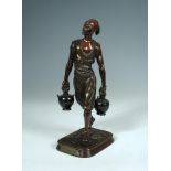 Jean Didier Debut, (French, 1824-1893) a bronze figure of the Porteur d'eau Tunisien, depicting a