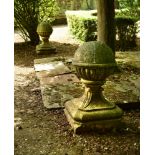 A pair of circular gadroon moulded marble gate post finials, on shaped square bases 59 x 37 x