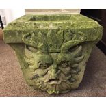 An architectural stone rain hopper, the front with carved satyr mask 36 x 34 x 28cm (14 x 13 x 11in)