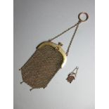 A Continental gold mesh evening purse together with a miniature example, the arched hinged snap