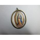 A yellow precious metal devotional pendant, the miniature contained within the frame depicting the