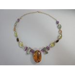 An 18ct gold and multi gemset statement necklace, composed of variously coloured quartzes, mainly