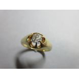 A Victorian single stone diamond ring, the old cushion cut diamond in a flying claw setting of