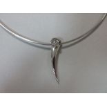 A platinum and marquise cut diamond pendant necklet, the polished looped pennant pendant collet