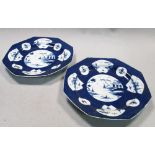 A pair of Bow blue and white octagonal plates, circa 1765, the powder blue ground body reserved with