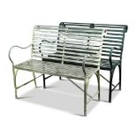 A pair of galvanised iron strapwork garden seats - 20th century one painted green (2) 93 x 107cm (36