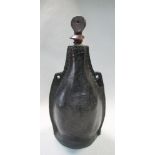 A leather Blackjack bottle flask, possibly 19th century, the stitched bottle with suspension loops