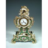 A 19th century porcelain mantle clock and stand by Jacob Petit, the enamel dial with Roman chapter