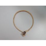 A Victorian gem set snake necklace, the body of graduated bulbous links of unmarked yellow