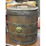 An oak and iron bound churn with brass top fitting