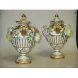 A pair of continental porcelain floral encrusted vases; an Augustus Rex ribbed vase and cover