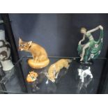 A Rosenthal model of a fox, an art deco figure of a dancer, Doulton model of a fox and a smaller one