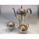 A silver three piece coffee set, maker Caldwell and Co, stamped sterling, 23oz