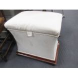 A white upholstered ottoman, 55 x 40 x 56cm