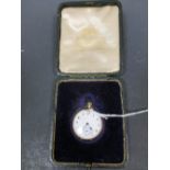 A pocket watch with engraved case (Swiss mark for 14ct gold?)