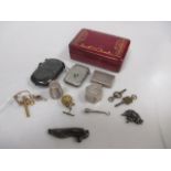 Two silver vestas, a silver pill box, a novelty boot shaped penknife, watch keys, etc