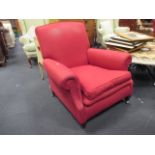 A modern pair of red armchairs (loose covers)