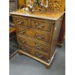 A miniature walnut chest of drawers, 78 x 61 x 37cm