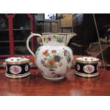 A large 19th century jug and a pair of Regency style Bough pots and covers (3)