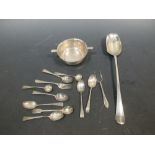 An 18th century silver basting spoon, various other spoons and small silver items, 13 oz