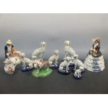 A group of Staffordshire figures of Dalmatians and a cow