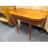 A Regency mahogany card table with boxwood stringing on castors 74cm high x 91cm wide