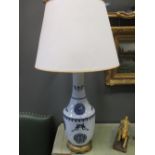 A ceramic lamp and shade